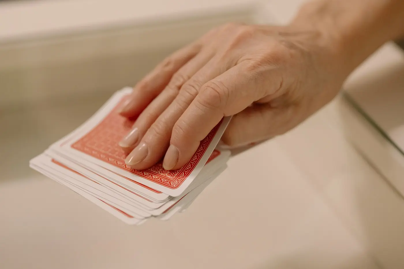 Hand picking a card from a deck